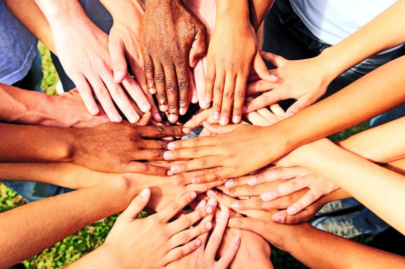 Create meme: many hands together, uniting people, unity of people