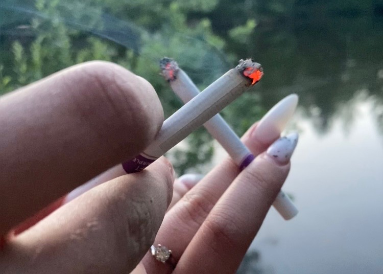 Create meme: cigarette aesthetics, female smoking, hand with a cigarette