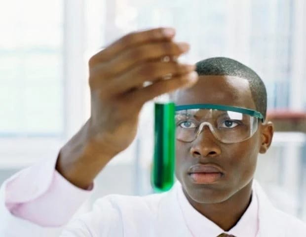 Create meme: the negro scientist, a negro with a test tube, chalk Board