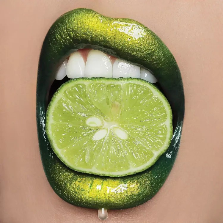 Create meme: lips with lime, lips with fruit, lips with lime in the mouth