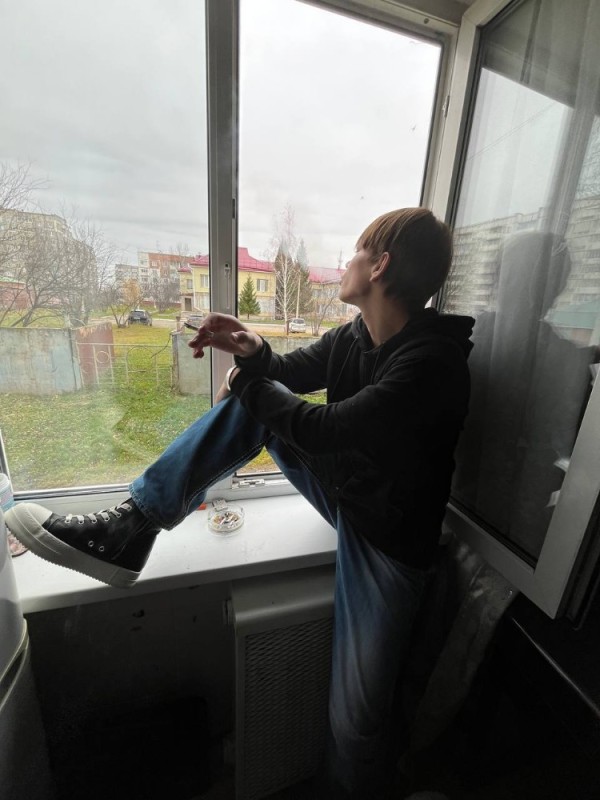 Create meme: A man is sitting on the window, people, The guy is sitting on the windowsill