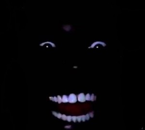 Create meme: Negro in the dark, darkness, Negro laughing in the dark