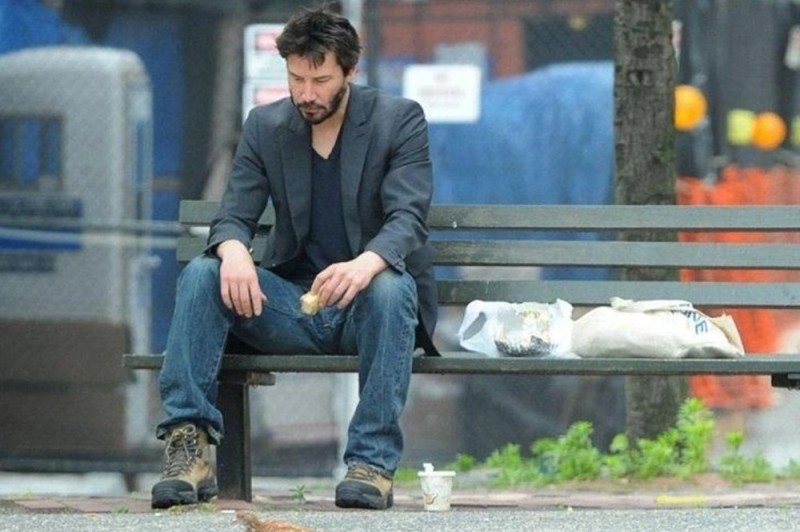 Create meme: Keanu Reeves on the bench, Keanu Reeves is sitting on a bench, Keanu Reeves 