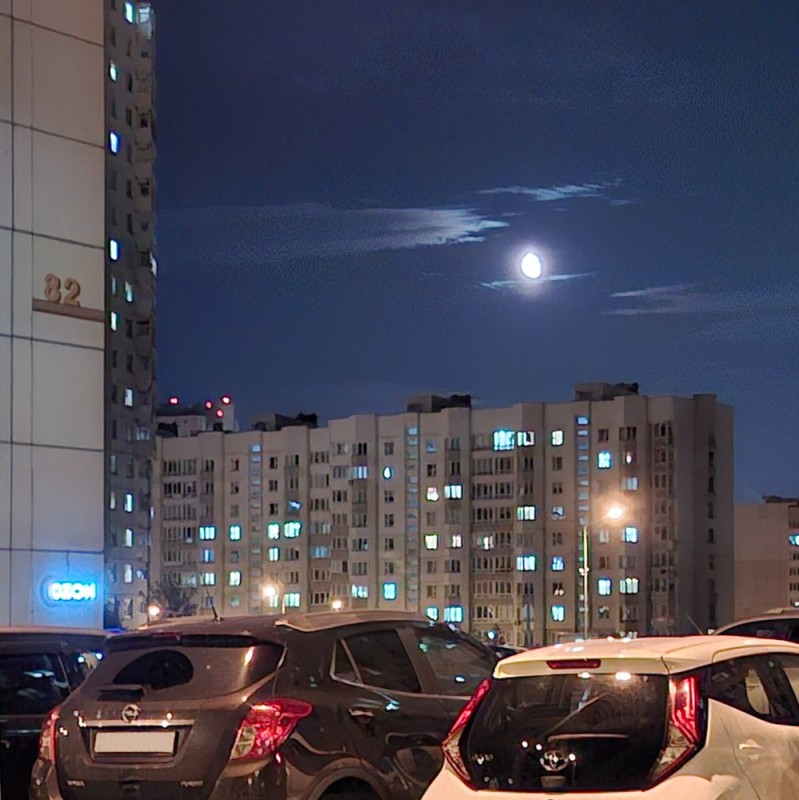 Create meme: moon over the city, Strange flashes in the sky, night