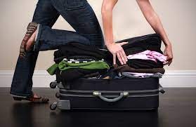 Create meme: packed suitcase, suitcase , The girl is packing a suitcase