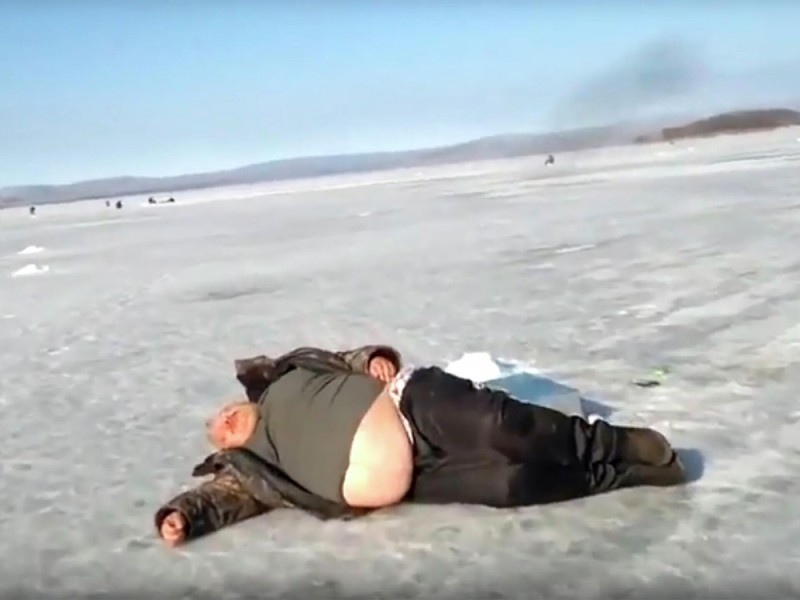 Create meme: The man is lying on the ice, fat man on ice, man on the ice normally