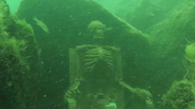 Create meme: sunken ships, A skeleton at the bottom of the sea, a skeleton in the water