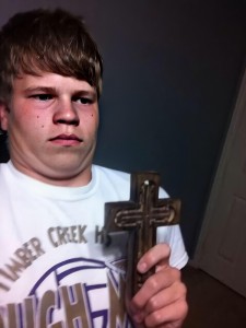 Create meme: with cross meme, man with a cross, the kid with a cross