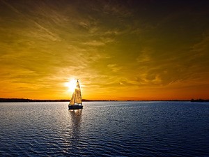 Create meme: yacht at sunset, sailboat at sunset, A boat at sea