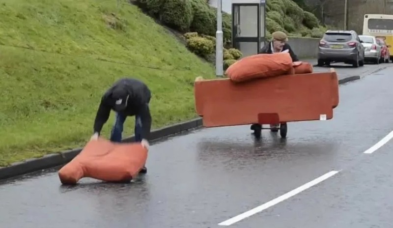 Create meme: dragging the sofa, movers are dragging a sofa, fun 