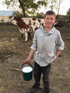 Create meme: farmer, boy, cow milk