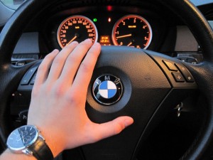 Create meme: car, the wheel of a bmw and a woman's hand, female hand on the wheel of the car of BMW
