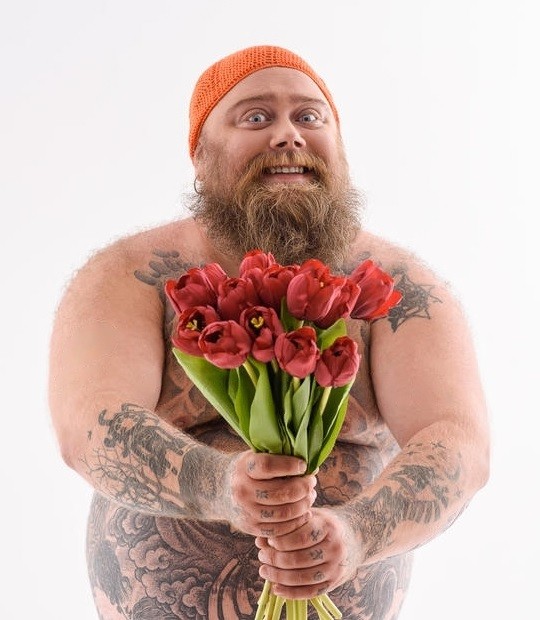Create meme: men with flowers are cool, bearded man with flowers, brutal man with flowers
