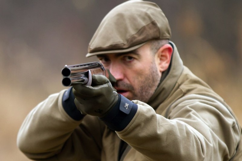 Create meme: a man with a gun, The hunter pointed his gun, shooting from