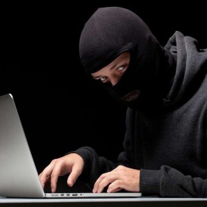 Создать мем: hacker, хакер в балаклаве, хакер в маске с ноутбуком
