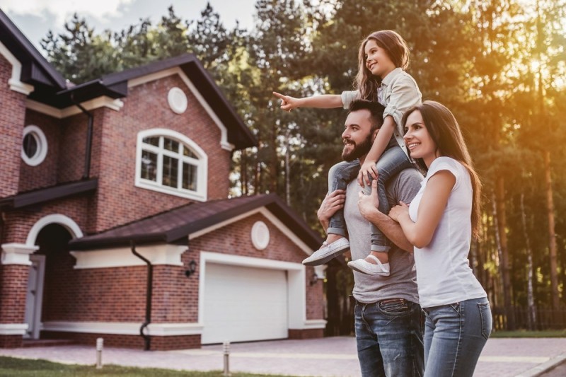 Create meme: happy family in the house, family on the background of the house, family in a country house