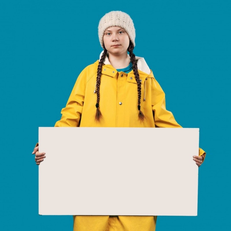 Создать мем: девушка, грета тунберг обложка, держит плакат