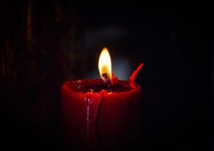 Create meme: candle picture, red candle on a dark background, burning candle on black background 1140