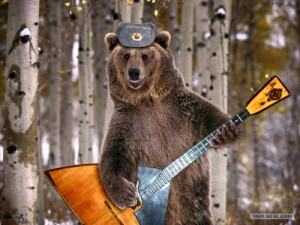 Create meme: balalaika, meme bear, Bear in a cap with ear-flaps and a balalaika