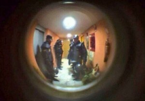 Create meme: photo look at photos then to the wall, FSB door peephole, police in a door peephole