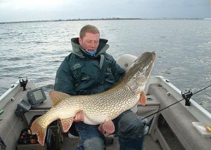 Create meme: pike, caught a pike, fishing in Karaganda region