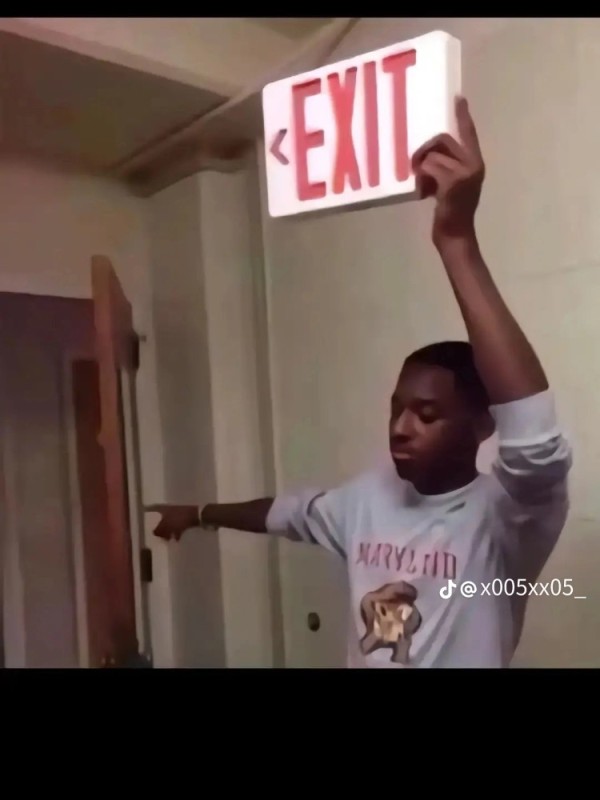 Create meme: Negro , Negro with a sign, the negro points to the exit