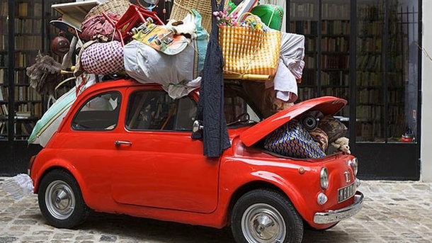 Create meme: auto , a car full of things, overloaded car