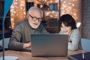 Create meme: grandfather, grandpa, grandfather and grandson looking at a tablet