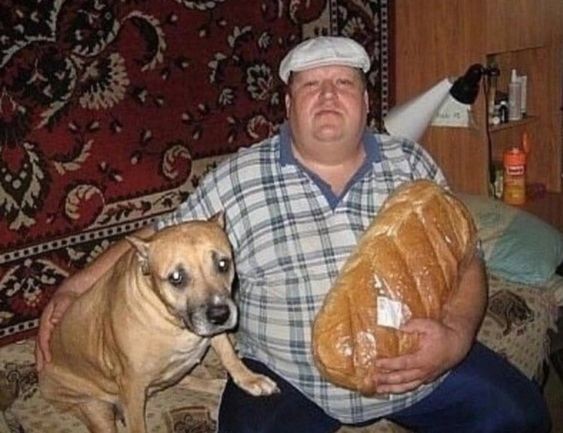 Create meme: a man with a dog and a loaf, Gerard Depardieu with a loaf, a man with a loaf and a dog meme