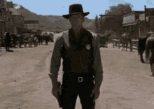 Создать мем: кадр из фильма, шериф гифка, вестерн