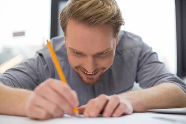 Create meme: people, a man is sitting at a table, a man draws at a table