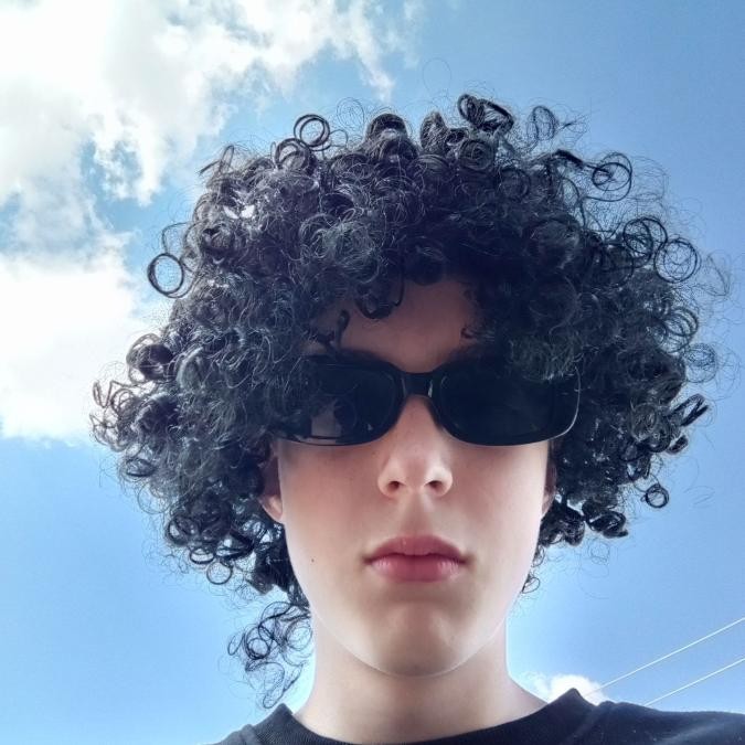 Create meme: guy , curly wig, curly-haired with glasses