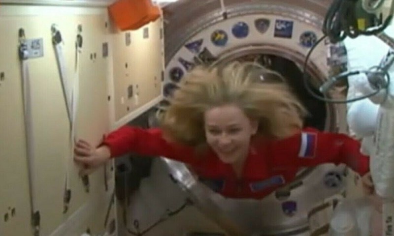 Create meme: women cosmonauts , Julia Peresild in space, an actress in space