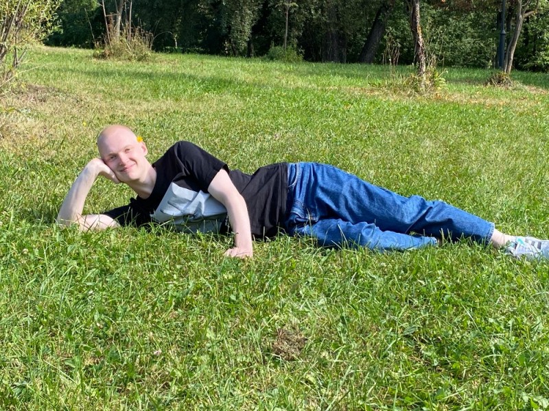 Create meme: male , A man is lying on top of the grass, someone lying