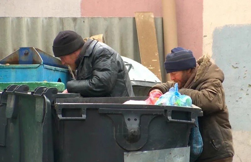 Create meme: a homeless man climbs in the trash, trash cans and bums, bum digging in the trash