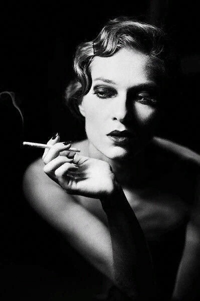 Create meme: a woman with a cigarette, a photo shoot in the noir style, girl with a cigar