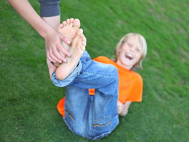 Create meme: tickling children's feet, Tickling the boy's heels, Tickling the boy's feet