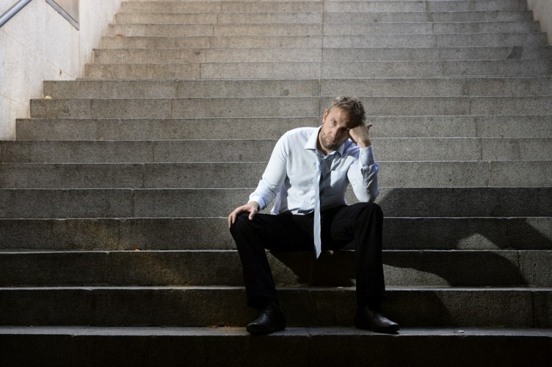 Create meme: A man is sitting on the steps, The man on the steps, A man is sitting on the steps