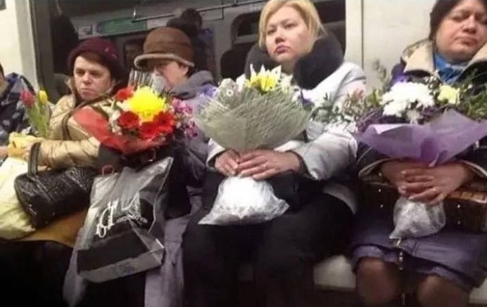 Create meme: women in the subway with flowers, So many sad women with flowers, woman with a flower