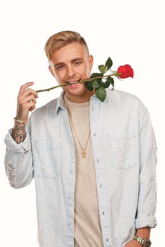 Create meme: bachelor Egor Krid, egor creed with flowers, a rose in a man's teeth