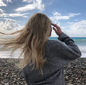 Create meme: girl, on the shore, blonde hair