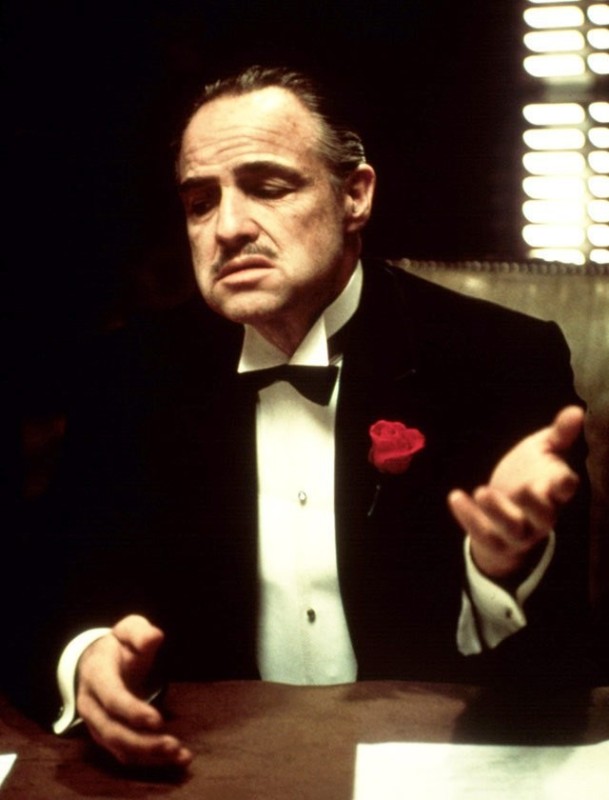 Create meme: Vito Corleone, the godfather Marlon Brando , don Corleone Smoking a cigar