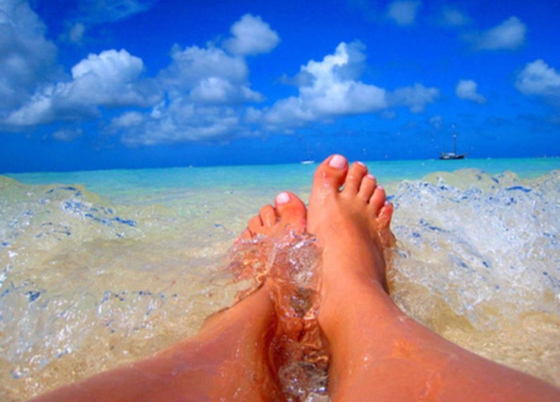 Create meme: legs on the background of the sea, beach legs, pedicure by the sea